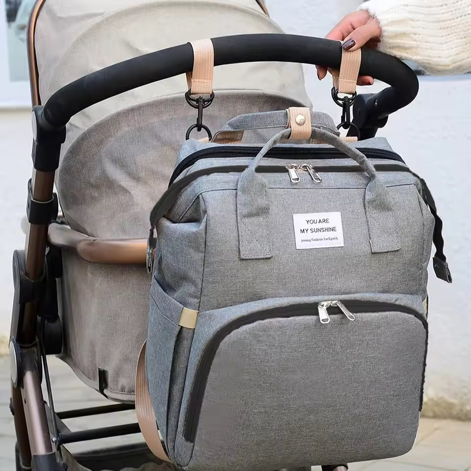 Pack Paseo Seguro: Mochila Maternal (Cuna Integrada) + Calentador USB de Regalo
